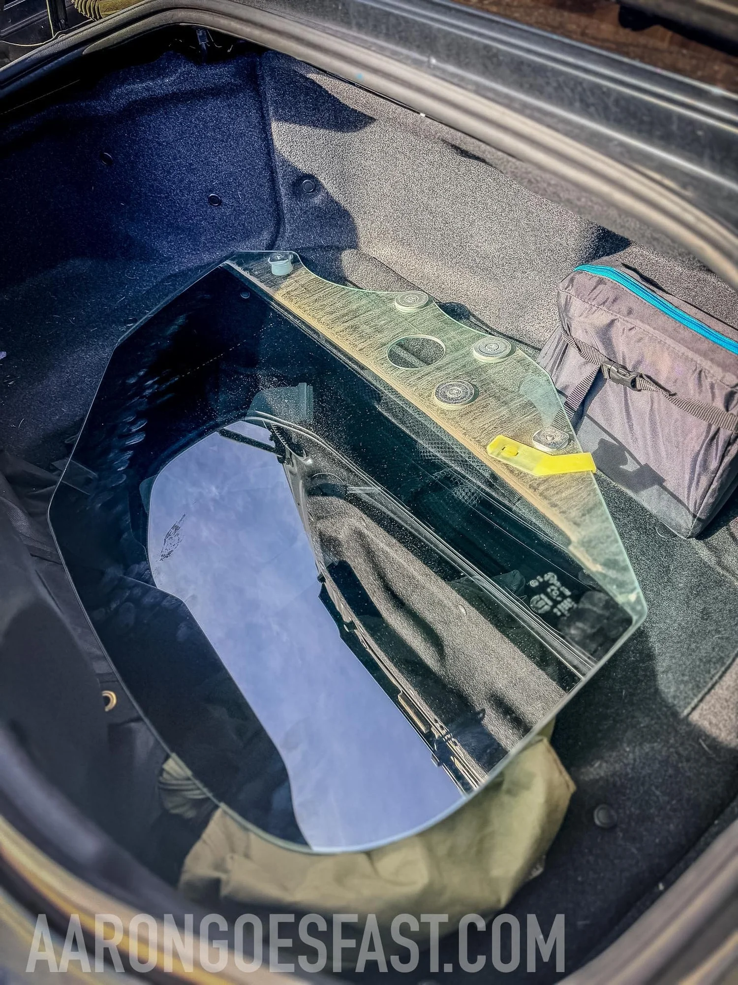 Fiat 124 Spider door glass lying in the trunk