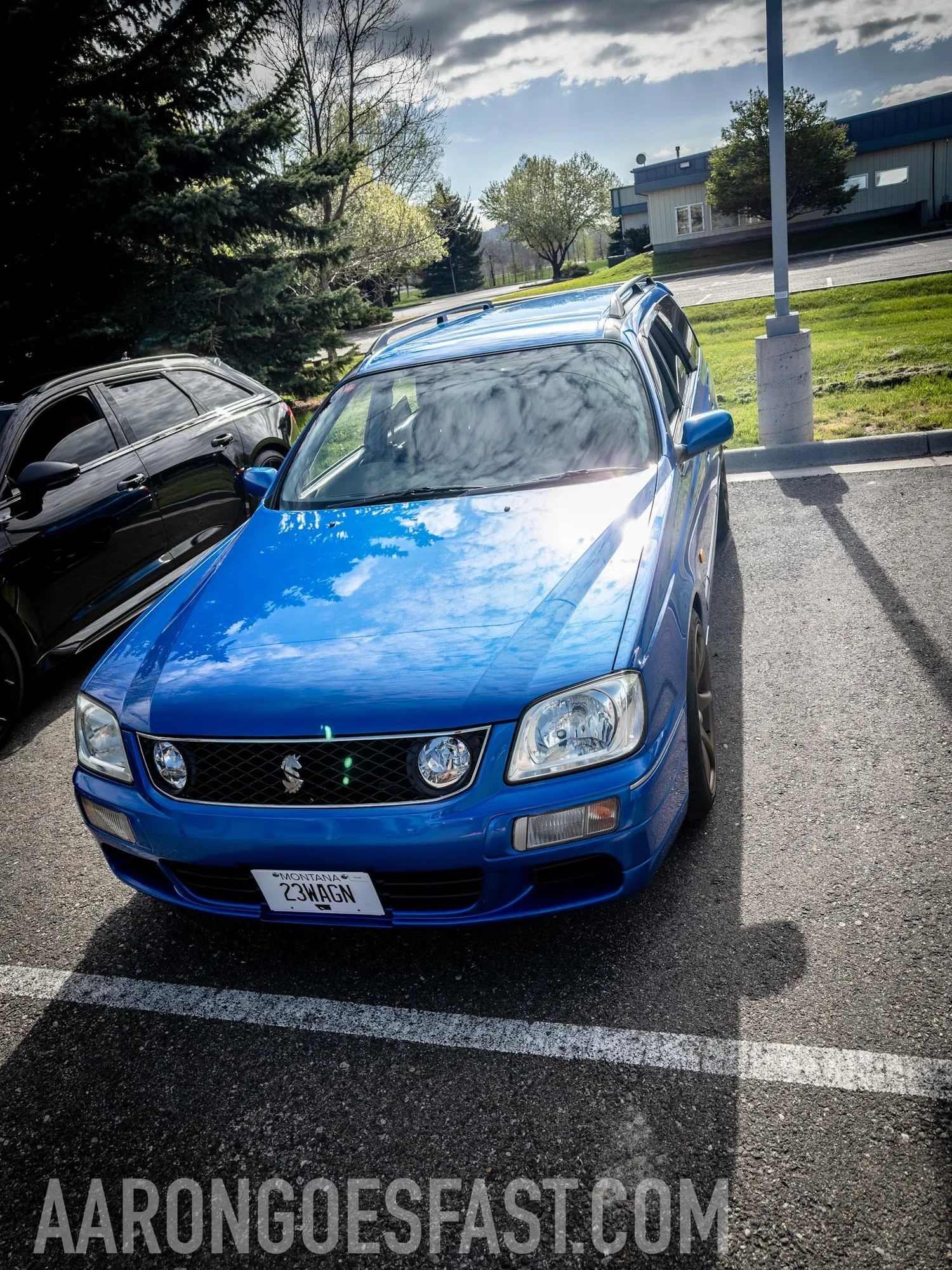 Blue Nissan Stagea wagon, a Japanese-market import