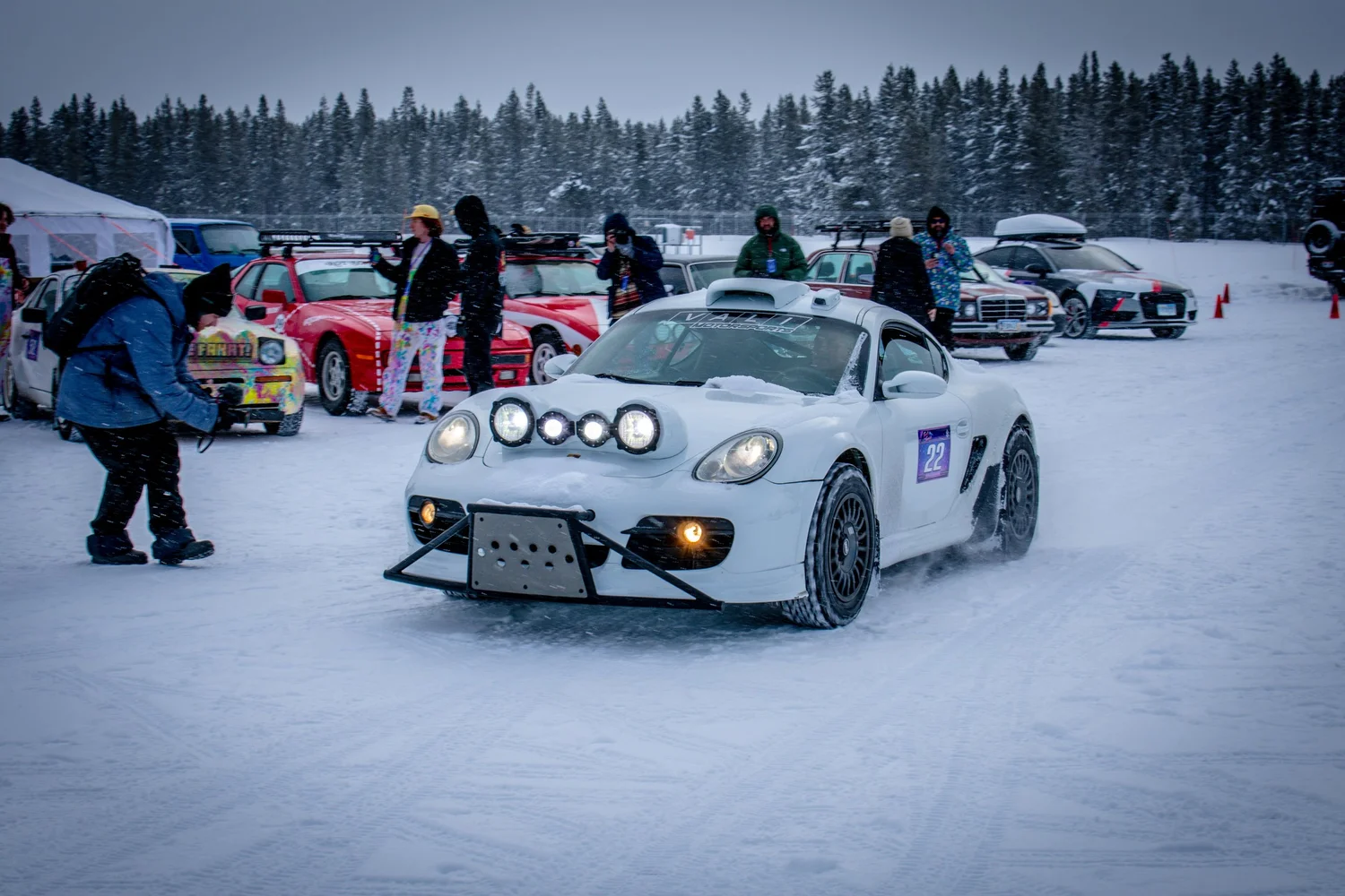 White Porsche Cayman number 22 with a rally light bar at the Frost and Furious ice races in West Yellowstone