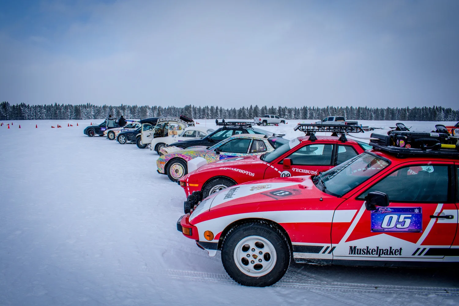 Red and white Porsche 944 number 05 on the ice at the Frost and Furious ice races in West Yellowstone