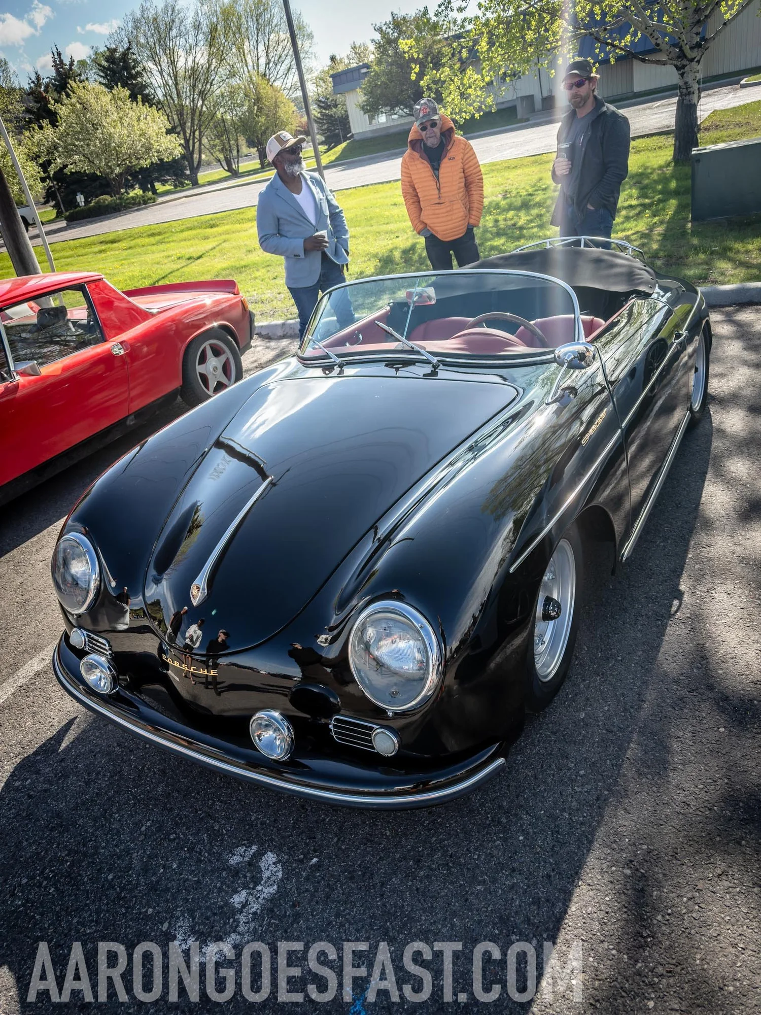 Black Porsche 356 Speedster with red interior