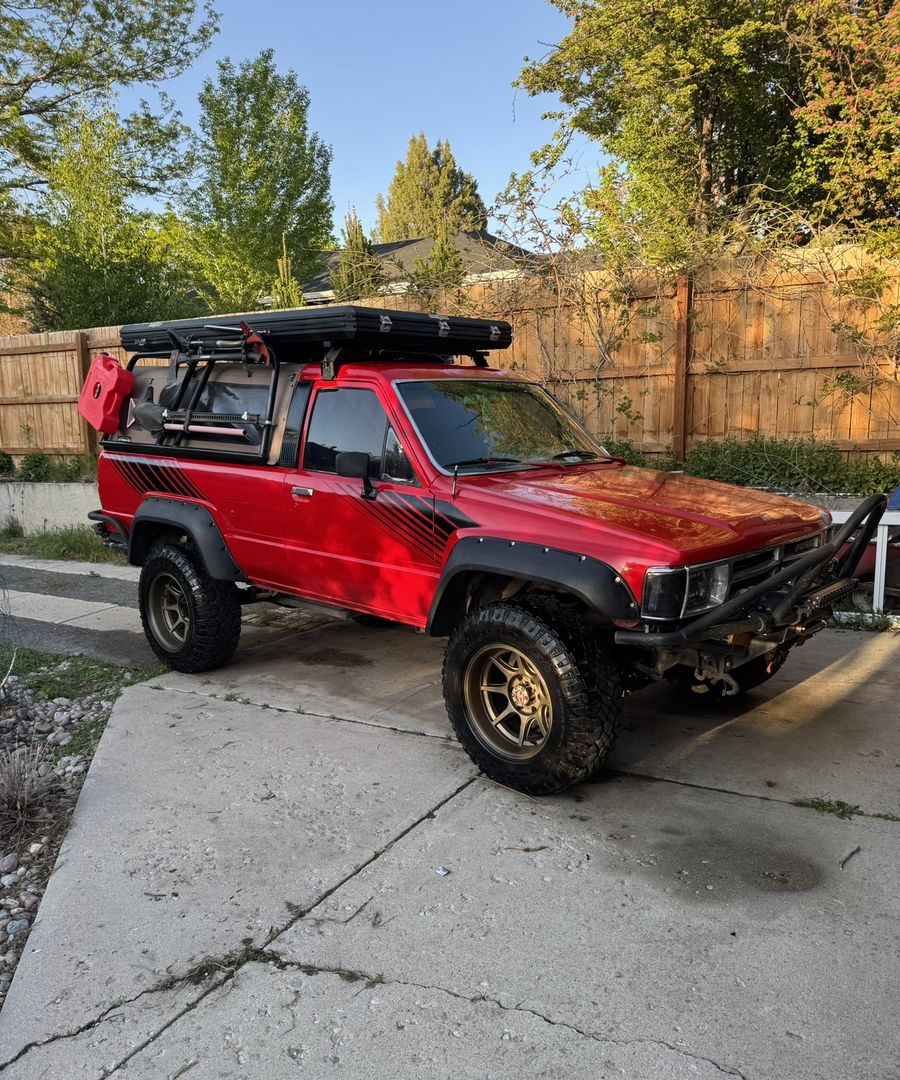 Red 1989 Toyota 4Runner with a roof rack and steel bumper in Salt Lake City