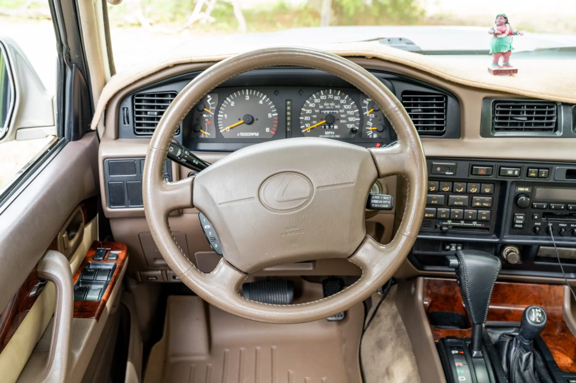 Tan leather steering wheel and gauges in the 1997 Lexus LX450