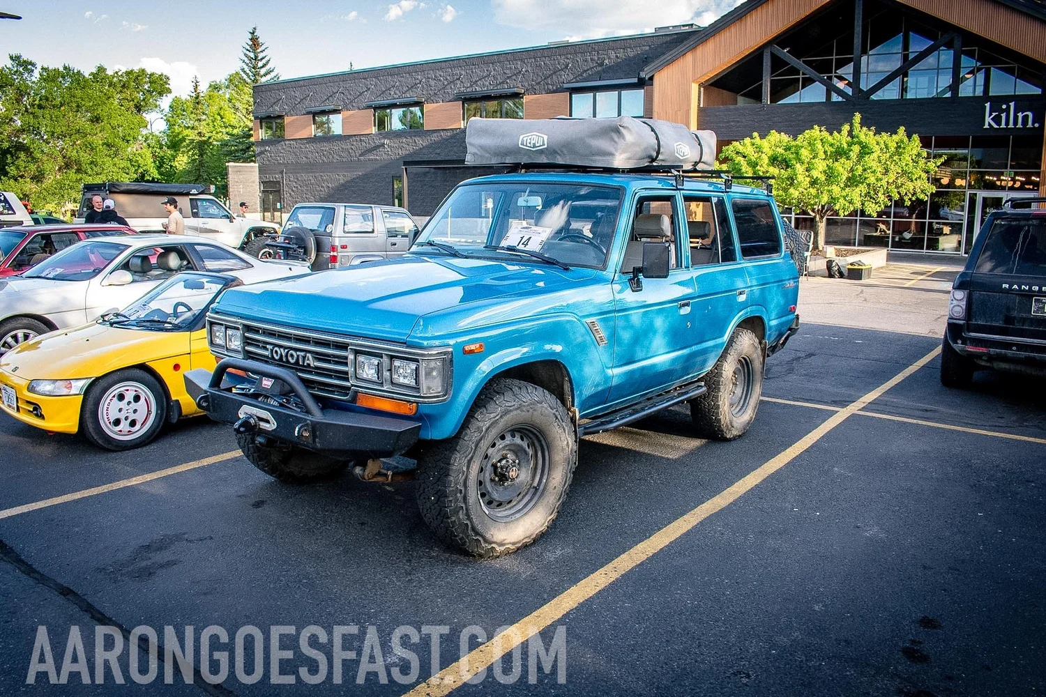 Blue 60 Series Toyota Land Cruiser with a roof rack at the Roly-Poly Daily Driver Show in Bozeman