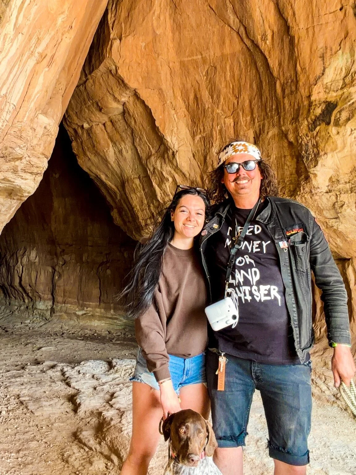 Aaron and Ashley with a dog during Cruise Moab 2026