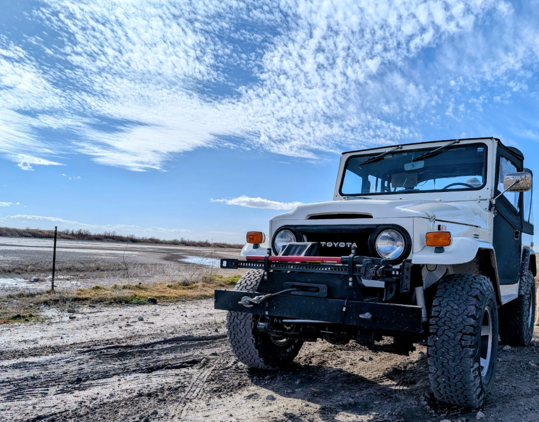 White 1974 Toyota FJ40 for sale in Ogden, Utah, under a big blue sky