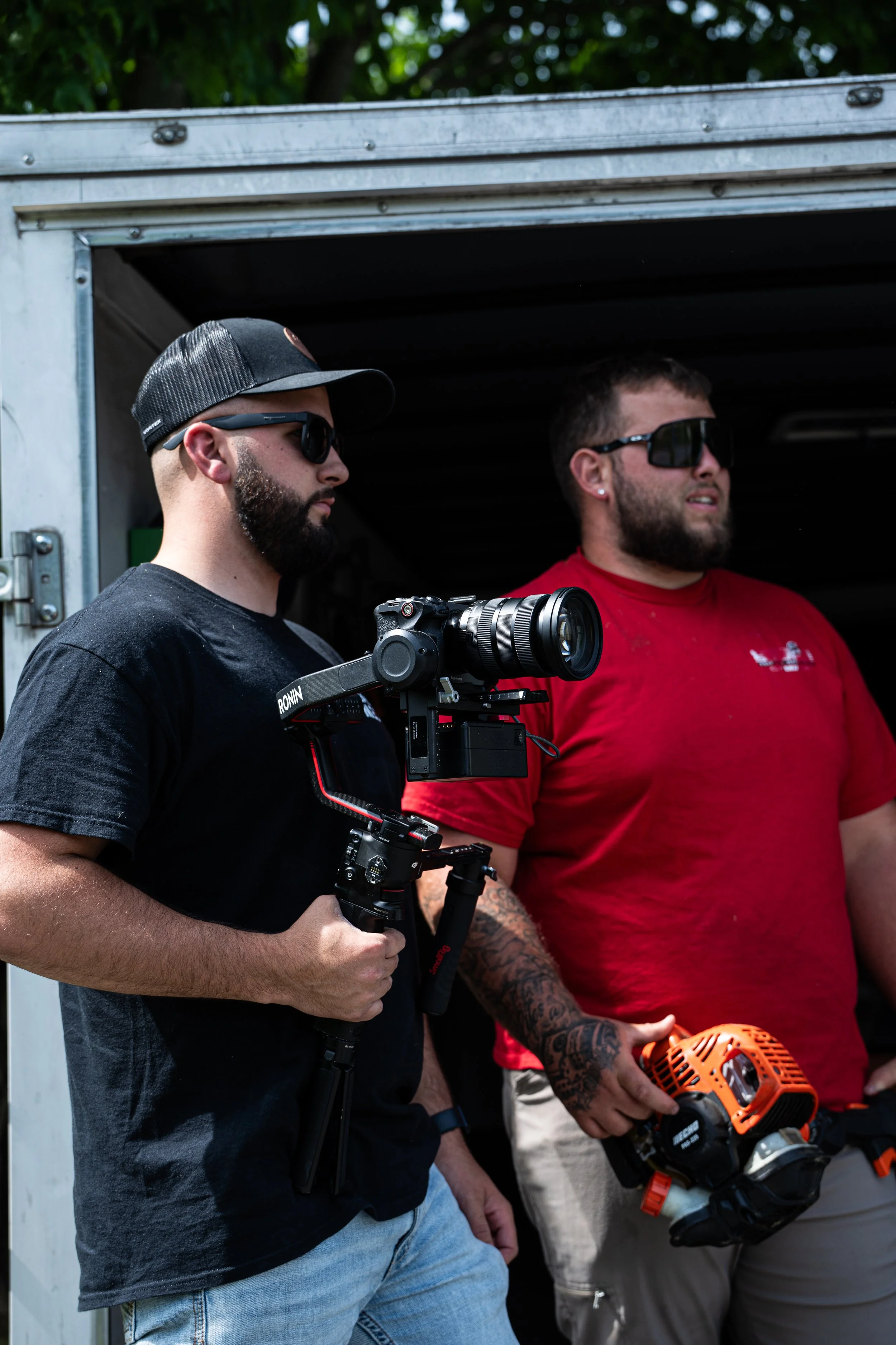 The Fearless Media team with camera gear outside a work truck