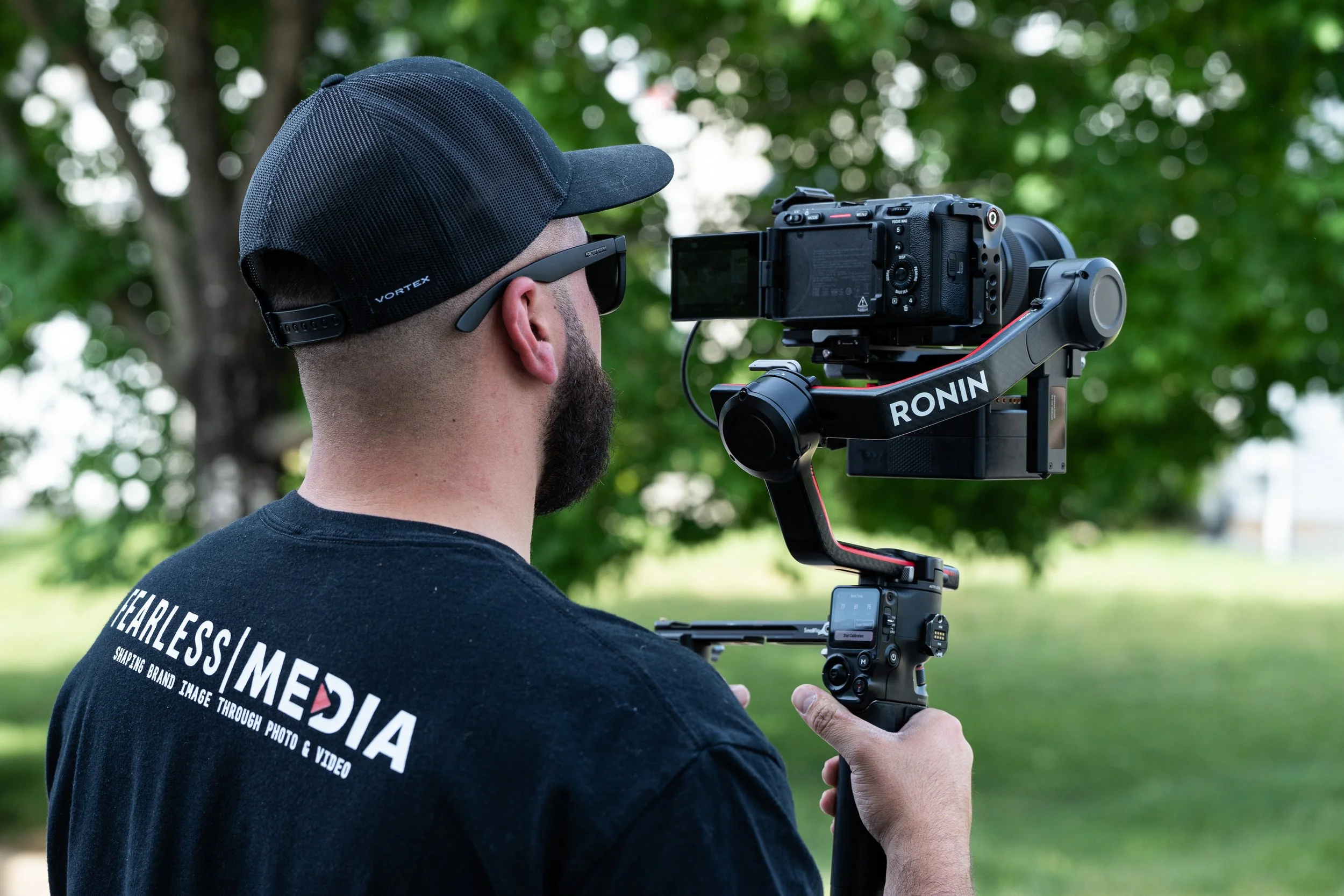 Fearless Media videographer filming with a gimbal-stabilized camera