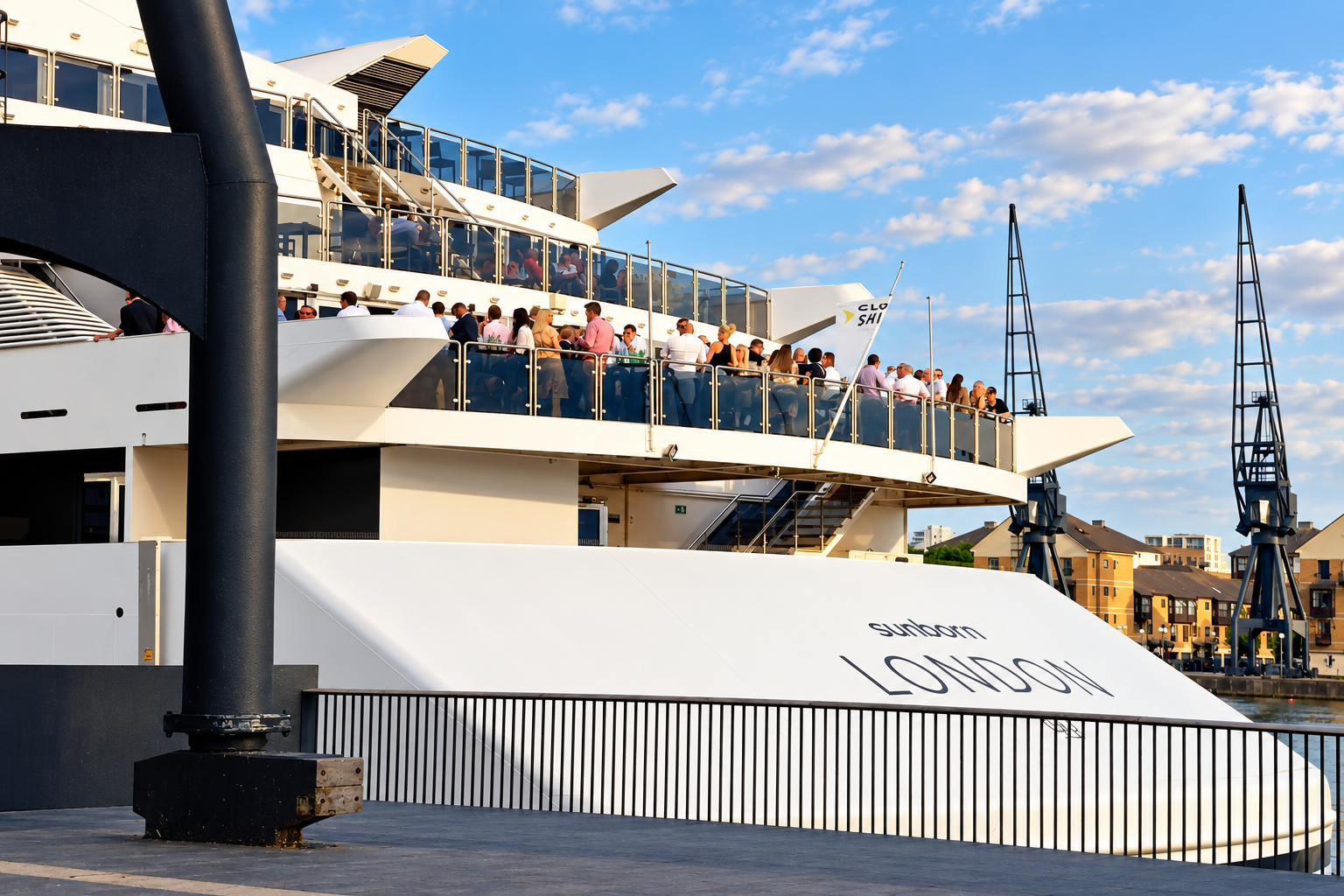 Guests gathered on a yacht deck in London