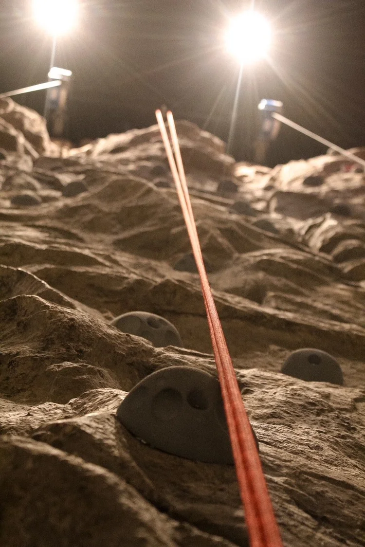 Rock climbing wall with auto-belay lines and floodlights at Silver Stone Castle, Swansea, MA