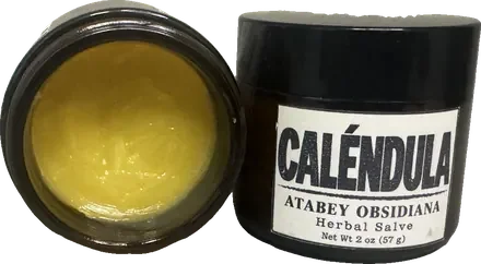 Open jar of Caléndula herbal salve
