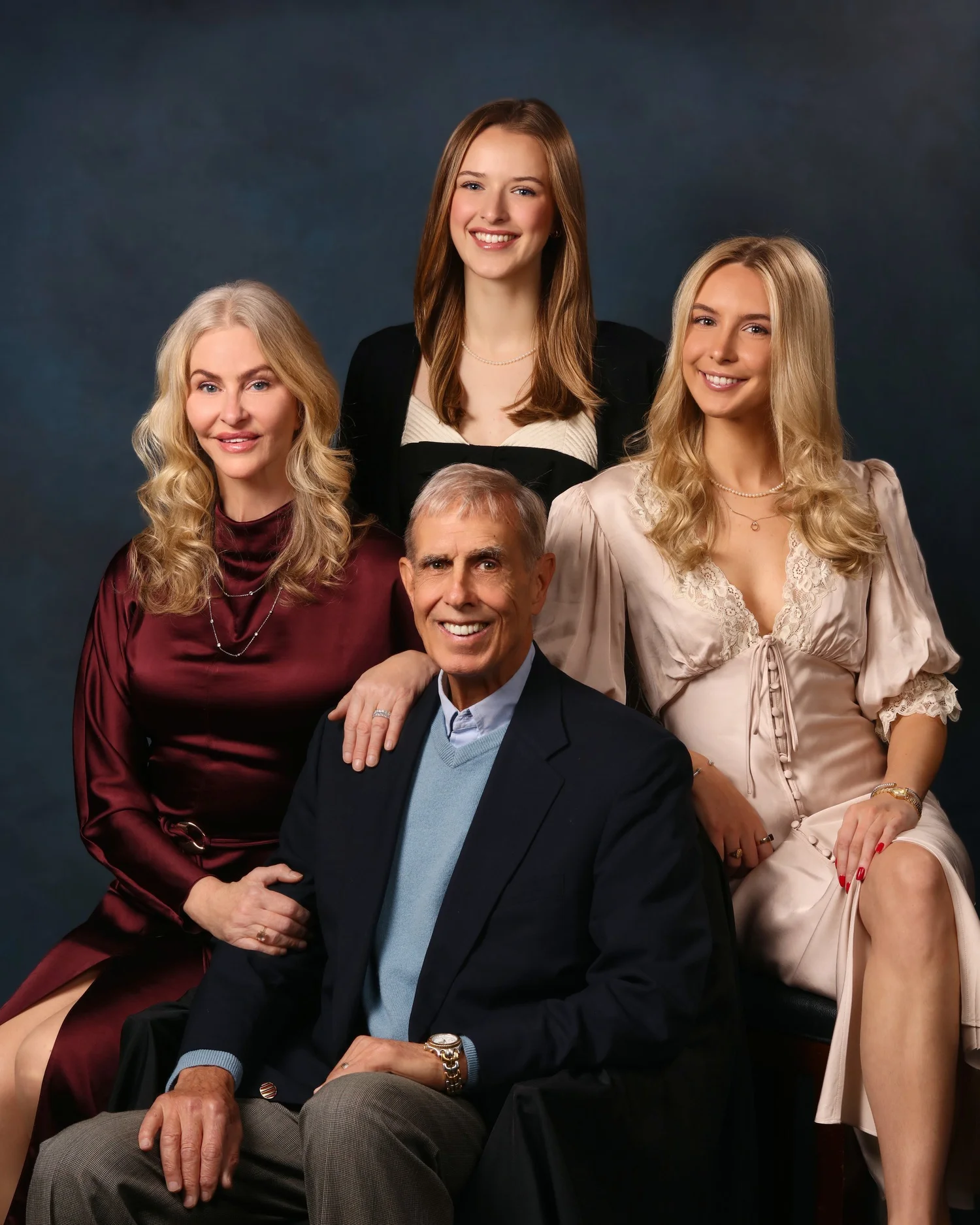 A family portrait made on a painterly studio set