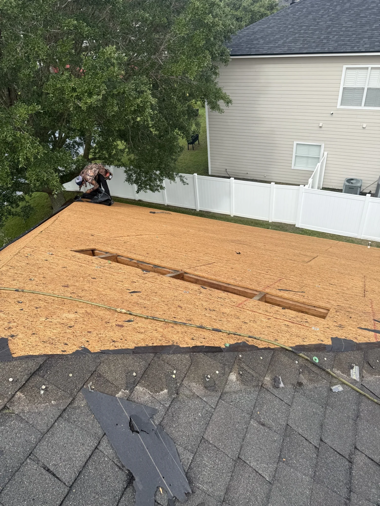 Section of damaged roof decking cut out for replacement