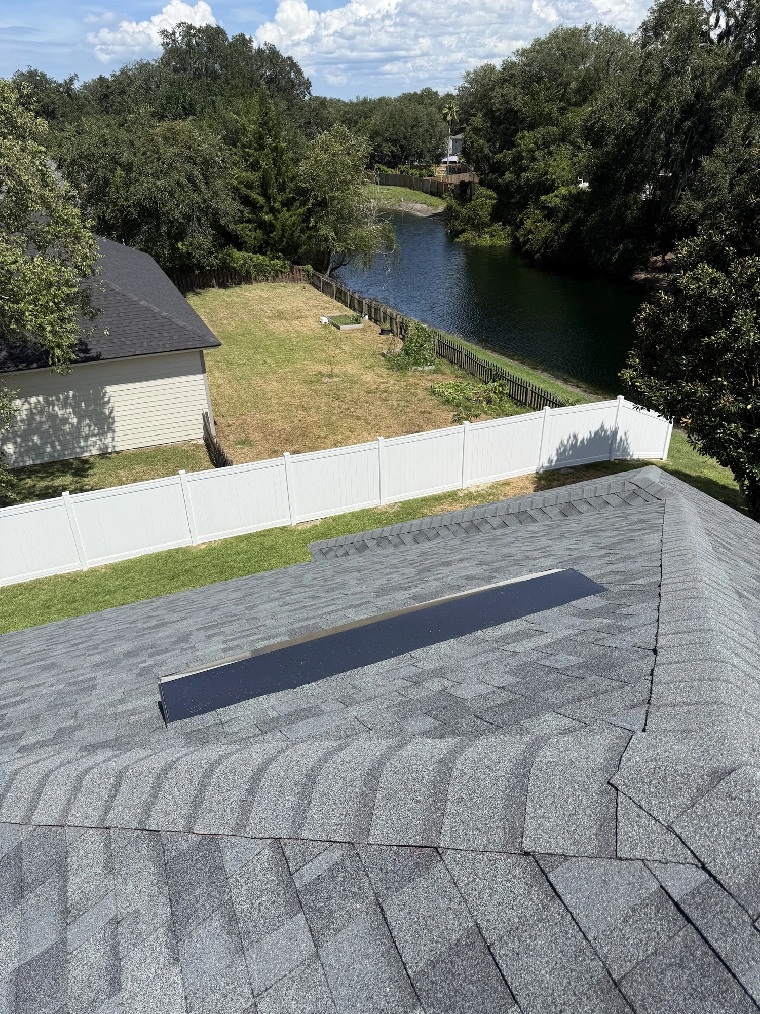 Roof exhaust vent on newly installed asphalt shingles