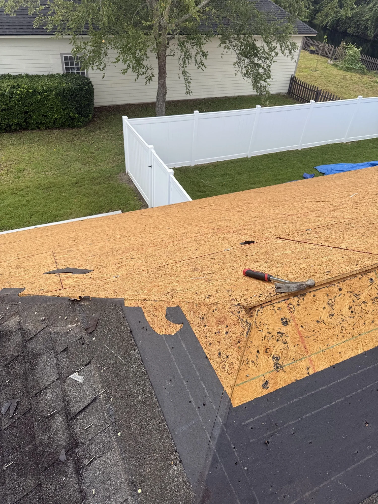 Bare roof decking exposed after tear-off on a 7V job