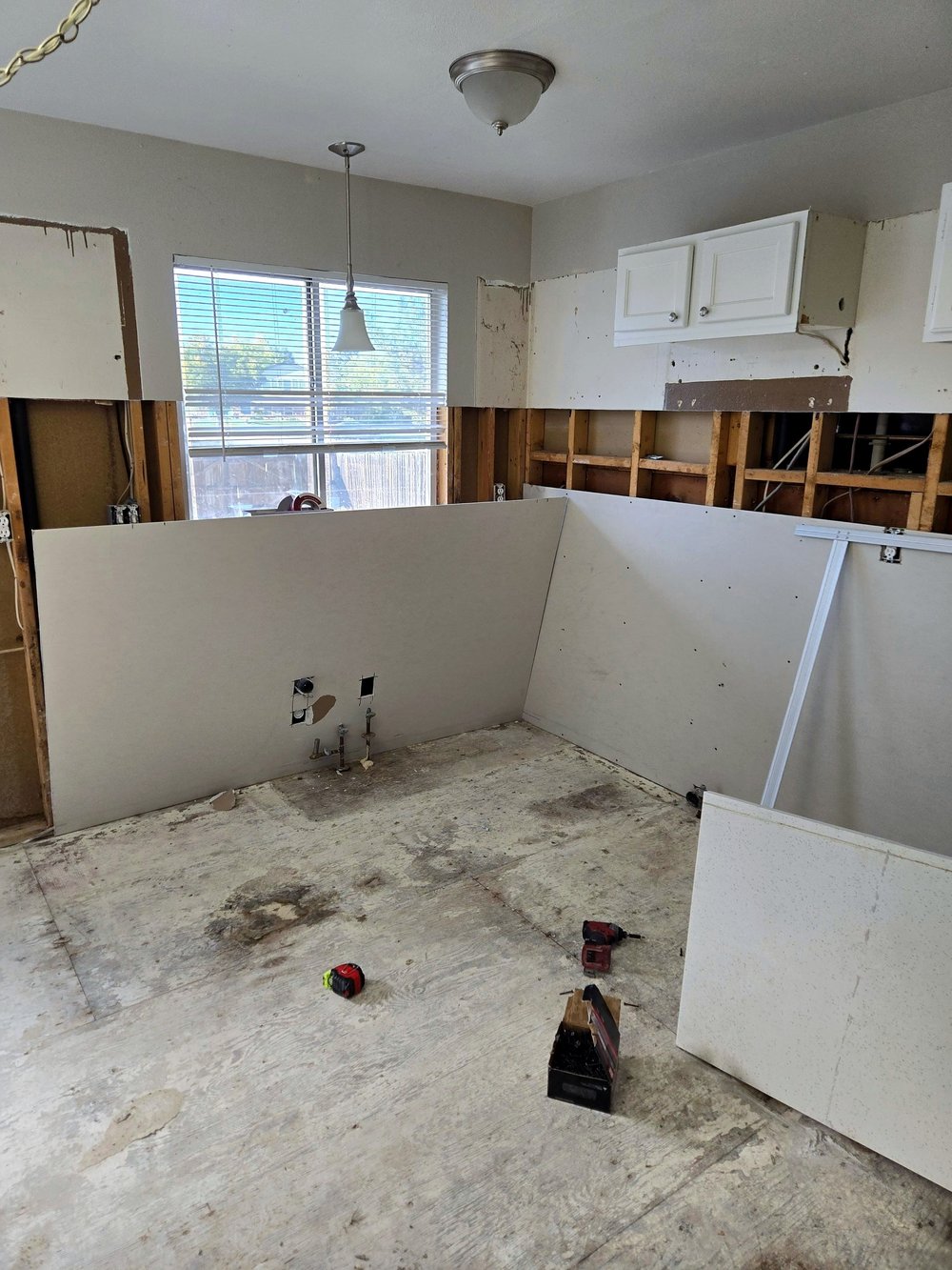 Before — kitchen gutted to the studs, Denver, CO