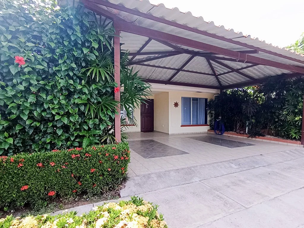 Private covered parking area at Sol Dorado House vacation rental in Costa Rica.