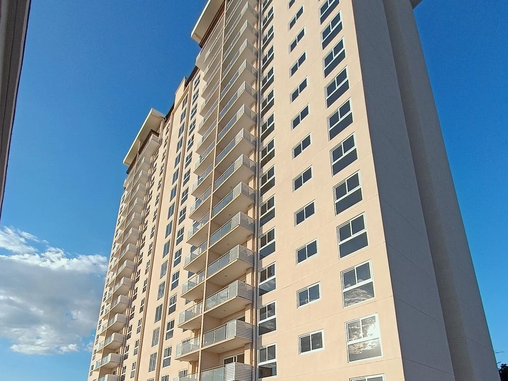 Contemporary condominium tower at Live Jacó residential complex in Jacó, Costa Rica.