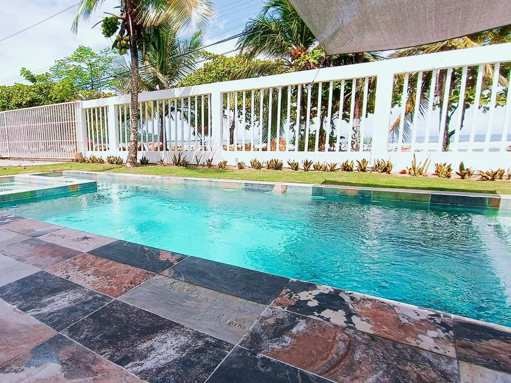 Oceanfront pool with direct beach access at Belford Apartments vacation rental in Jacó Beach Front, Costa Rica.