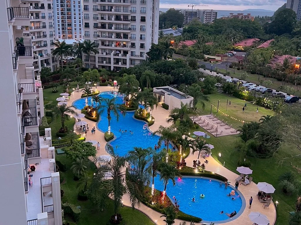 Lagoon-style swimming pool with tropical landscaping at Jacó Bay vacation property in Jacó, Costa Rica.