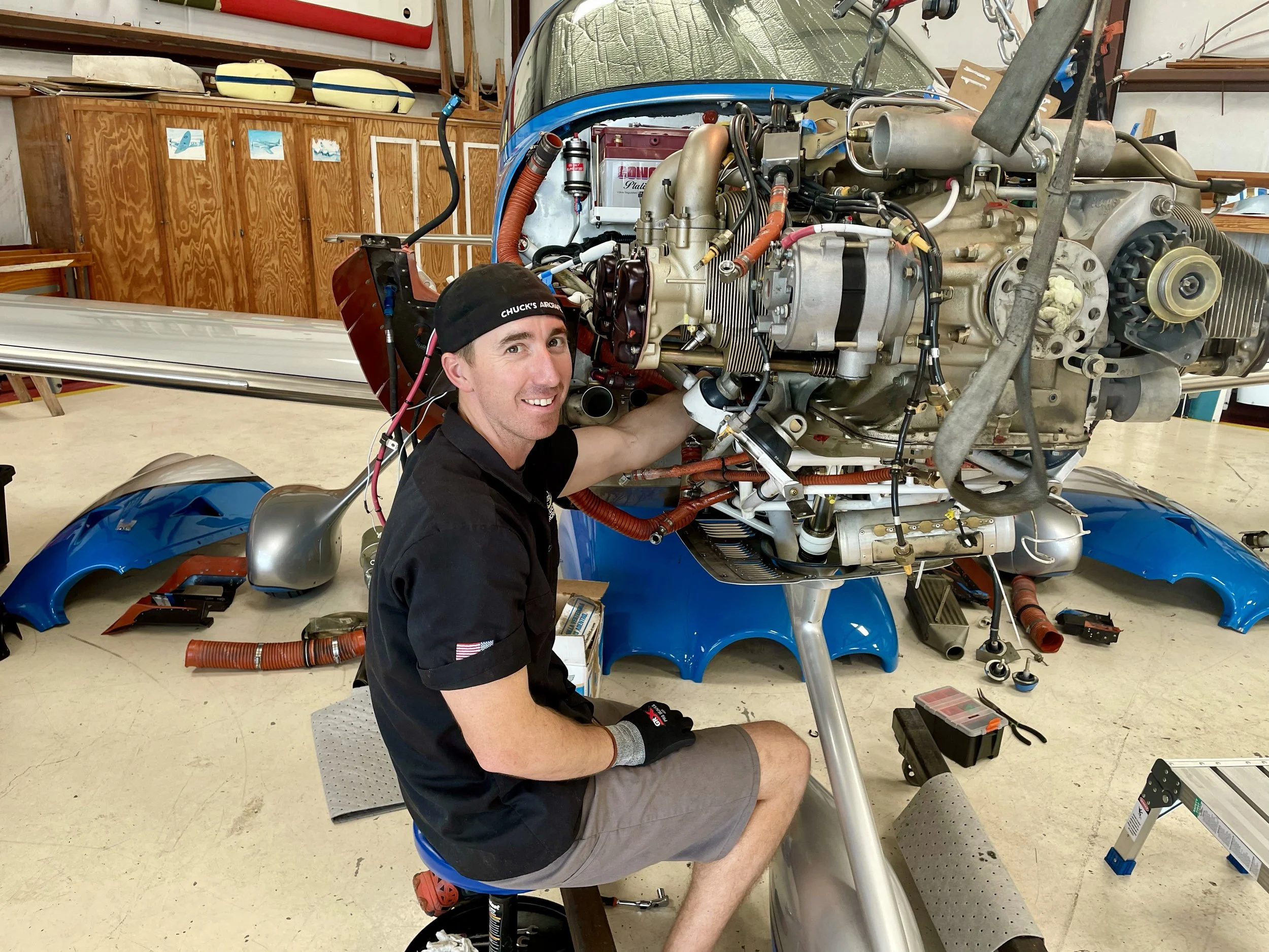 Nick Bownds performing maintenance on a general aviation aircraft engine