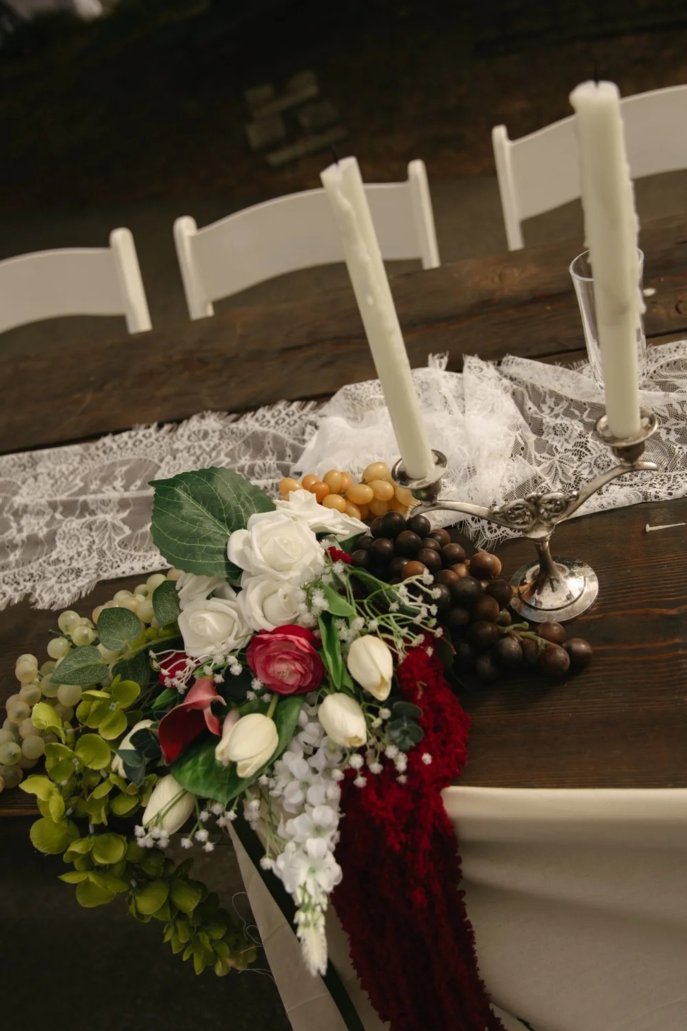 Florals, lace runner and a silver candelabra