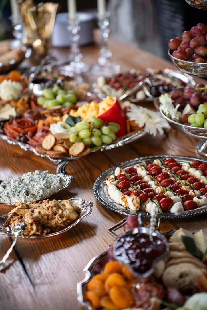 A silver grazing spread on a wood table