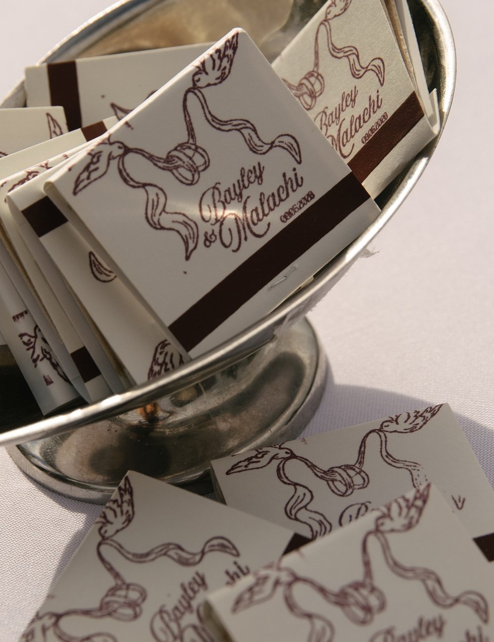Custom matchbooks in a silver bowl