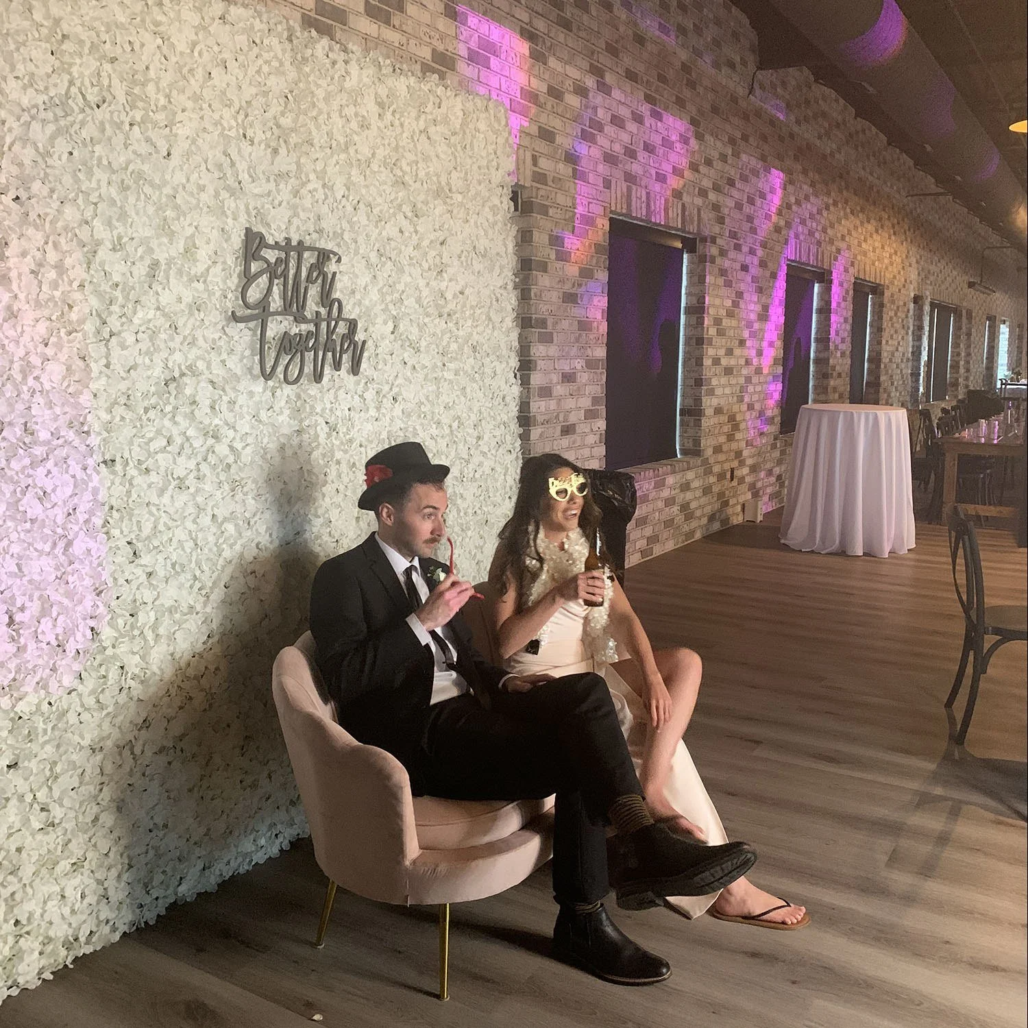 White Floral Wall used as a wedding photo backdrop.