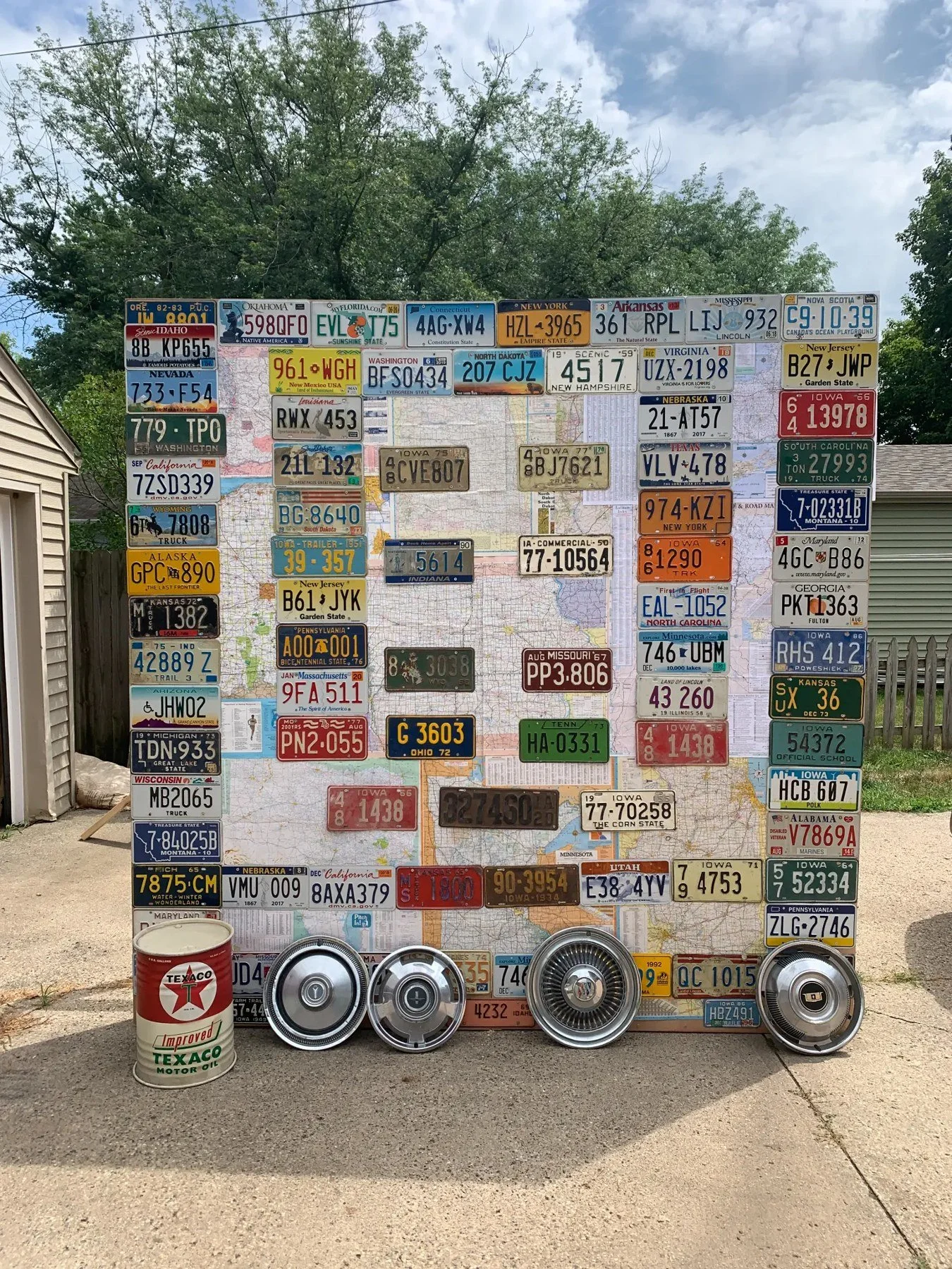 Travel Wall with vintage license plates and maps.