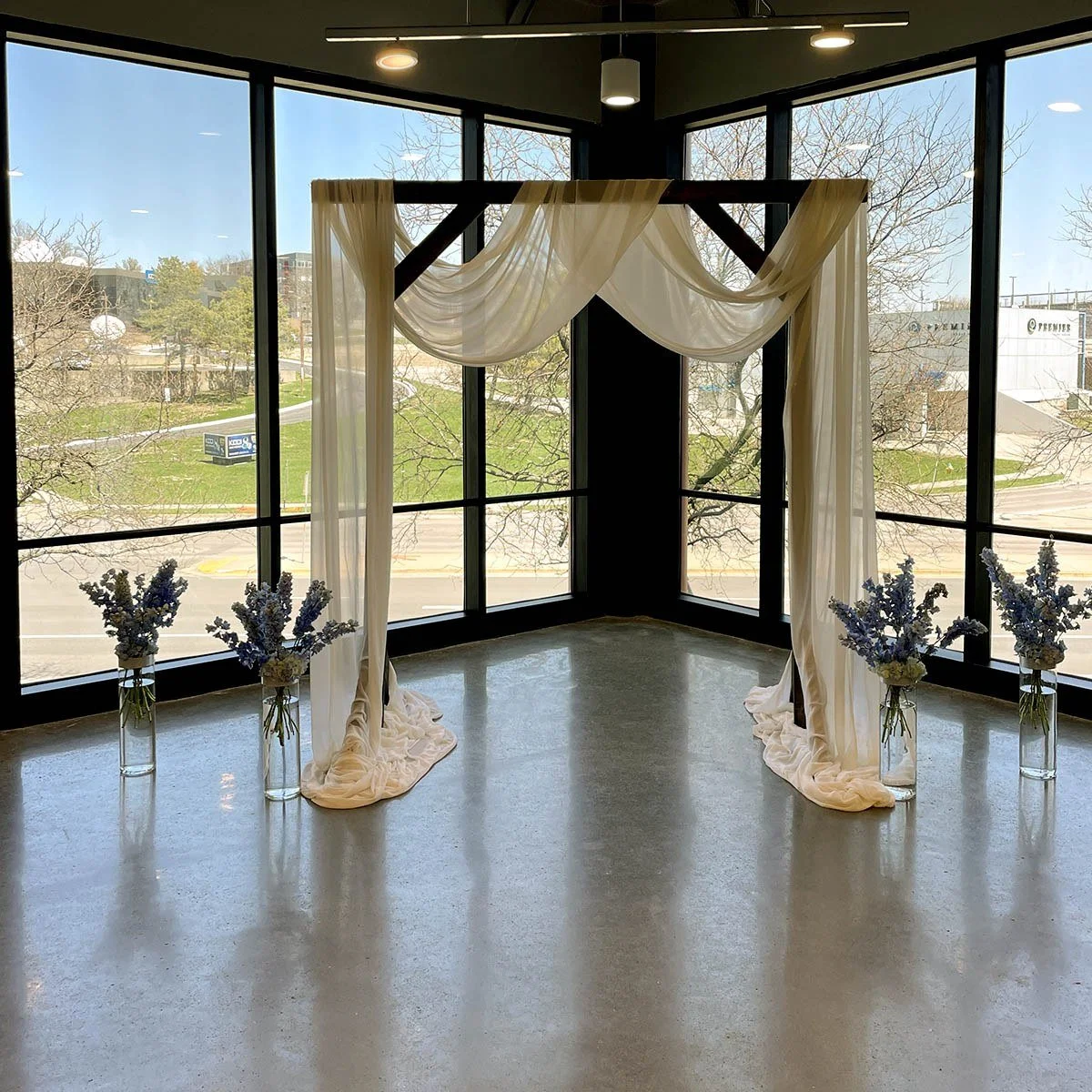 Dark Brown Rectangular Arch styled with ivory draping.