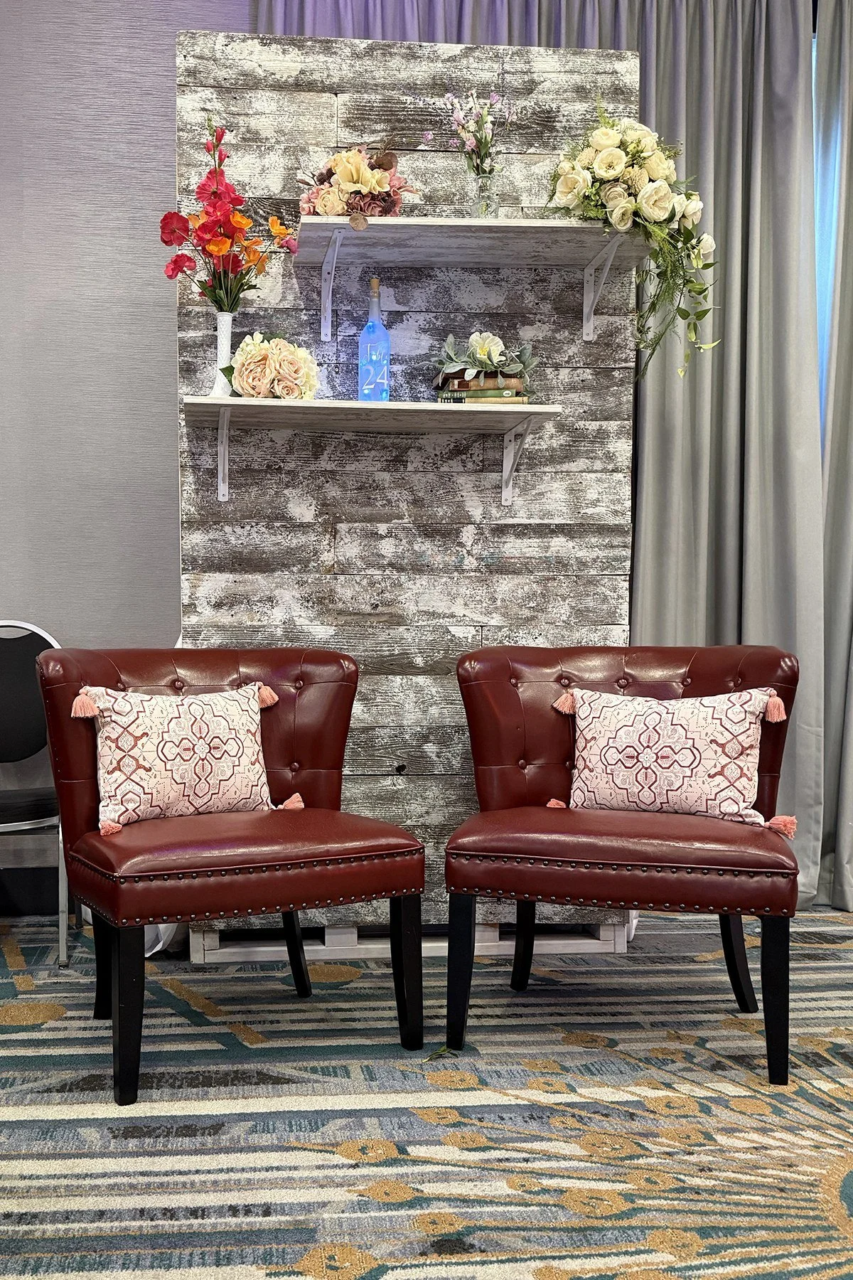 Maroon leather accent chairs.