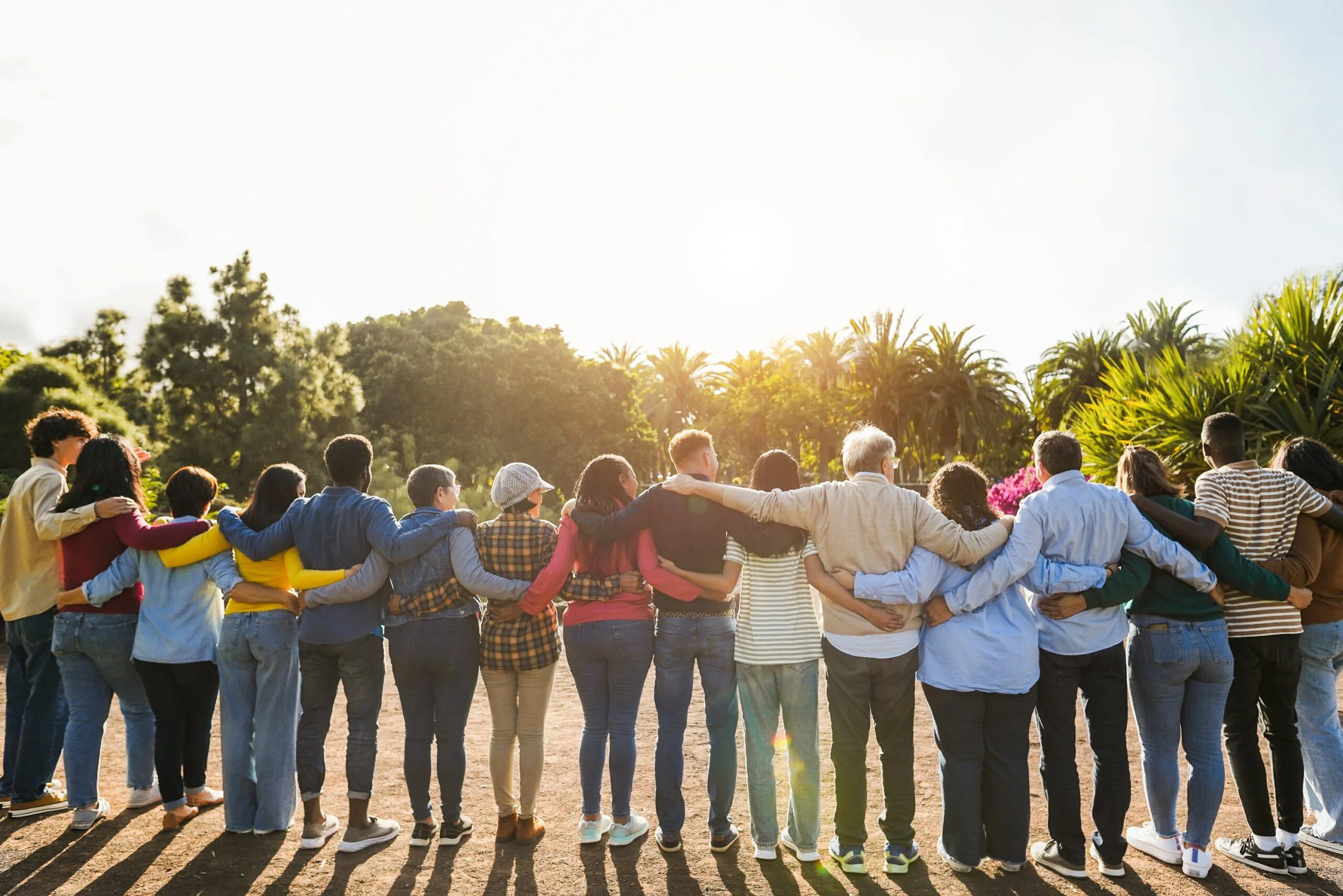 people standing with arms around eachother