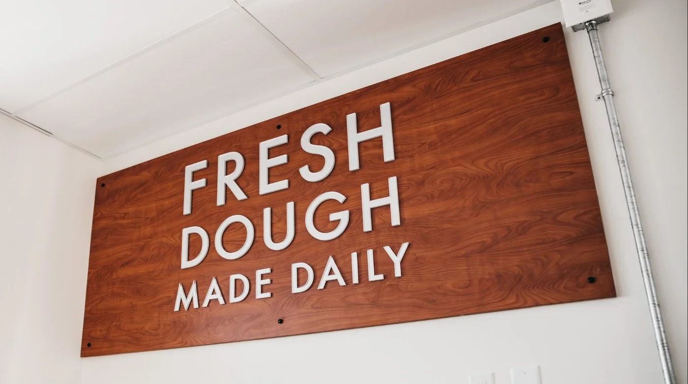 Fresh Dough Made Daily sign inside a Papa Murphy's store