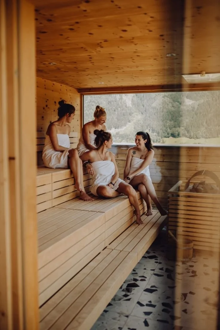 Friends talking in the sauna