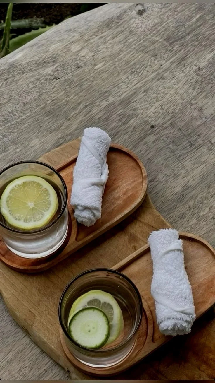 Rolled towels and lemon water