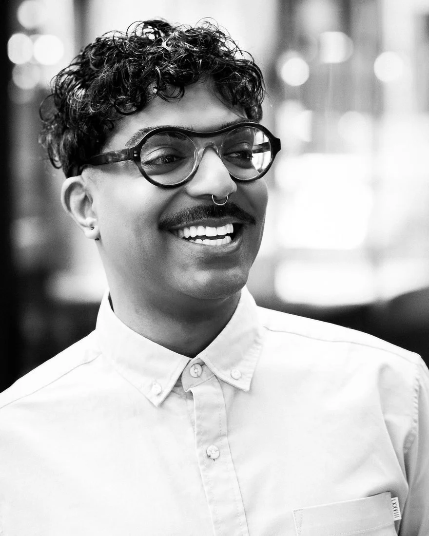 Rahim Thawer, host of The CBT Dive, smiling in a white button-down shirt