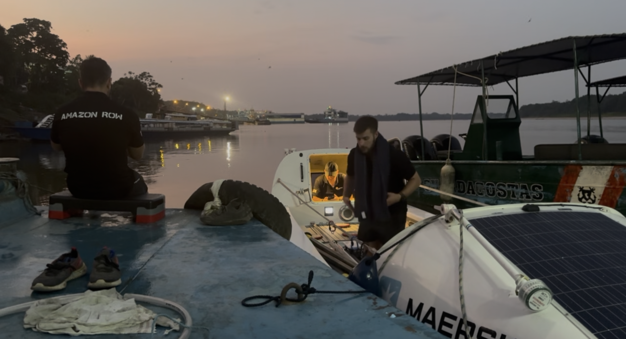 Endurance Limits Amazon Row team preparing their boat at the river dock before starting the Amazon River expedition.