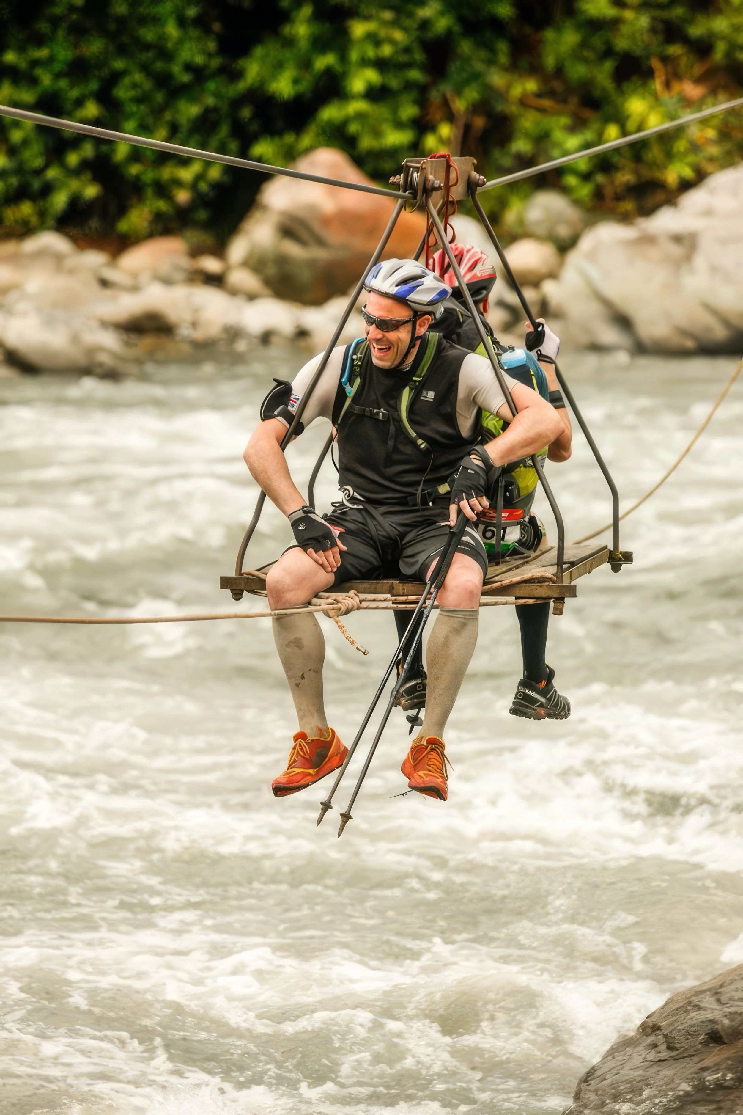 Darren from the Endurance Limits team crossing a river in Peru during the Peru Ultra Marathon adventure.