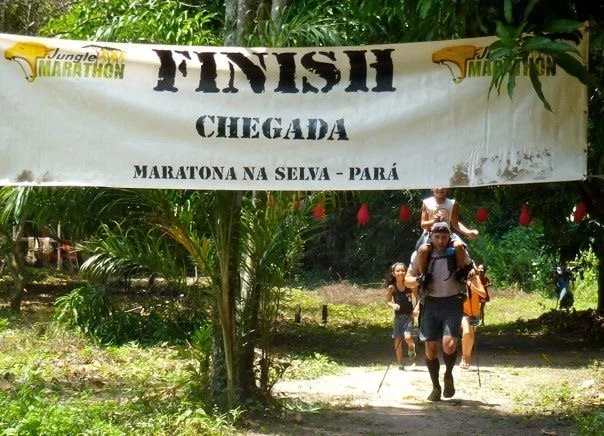 Darren of the Endurance Limits Brazil Jungle Ultra Marathon team crossing the finish line of the adventure race.