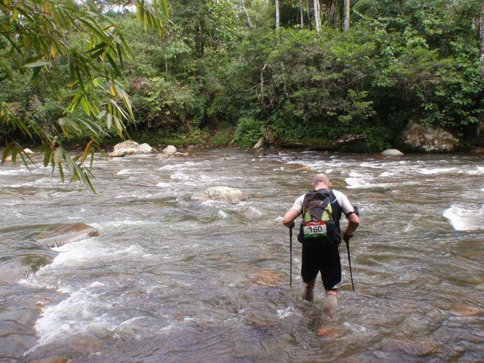 Darren of the Endurance Limits Peru Ultra Marathon team crossing a river during the endurance adventure.