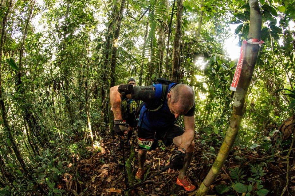 Darren of the Endurance Limits Peru Ultra Marathon team climbing a steep jungle section during the adventure race.