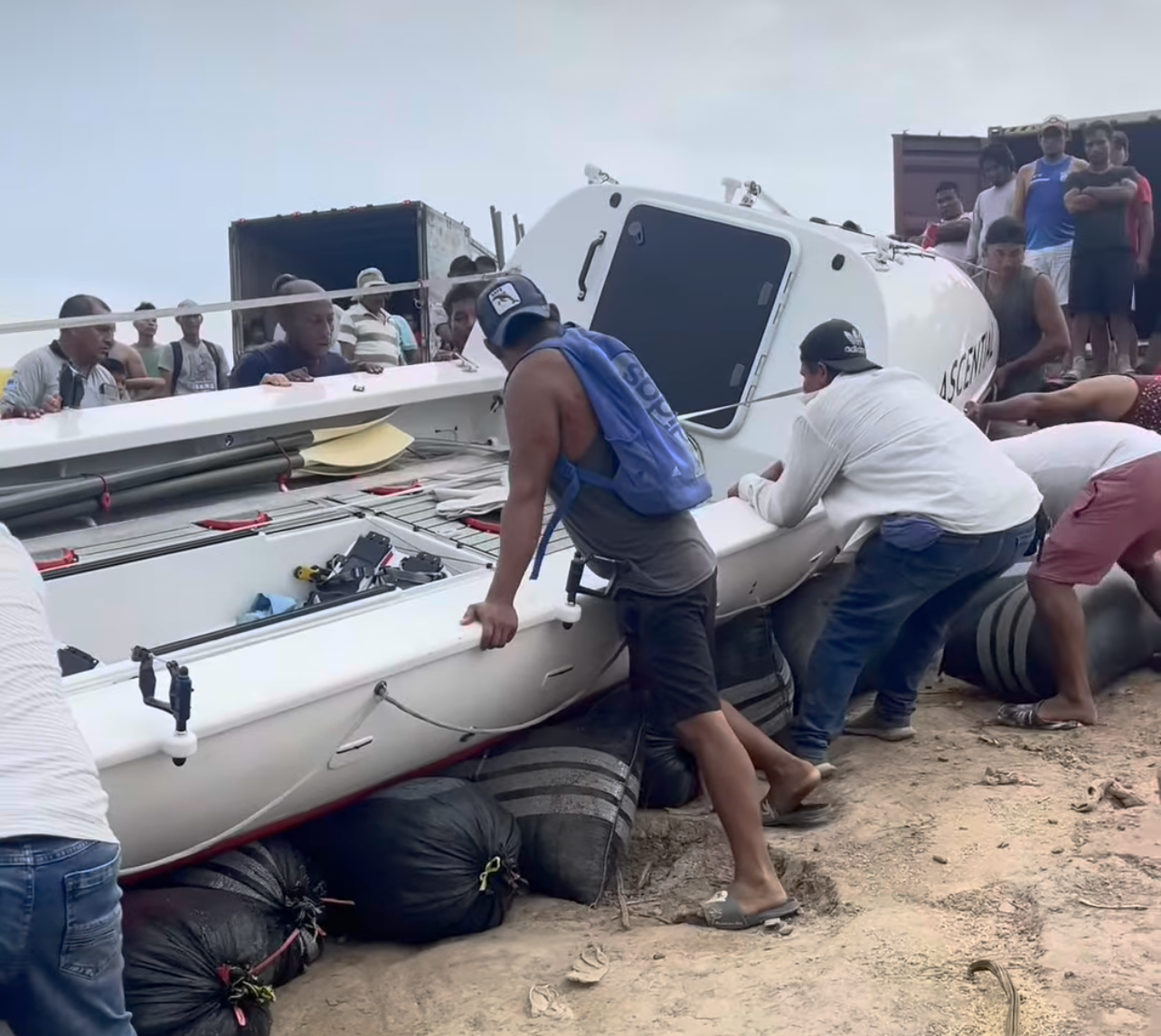 Endurance Limits Amazon Row team with local residents assisting the boat on the Amazon River expedition.