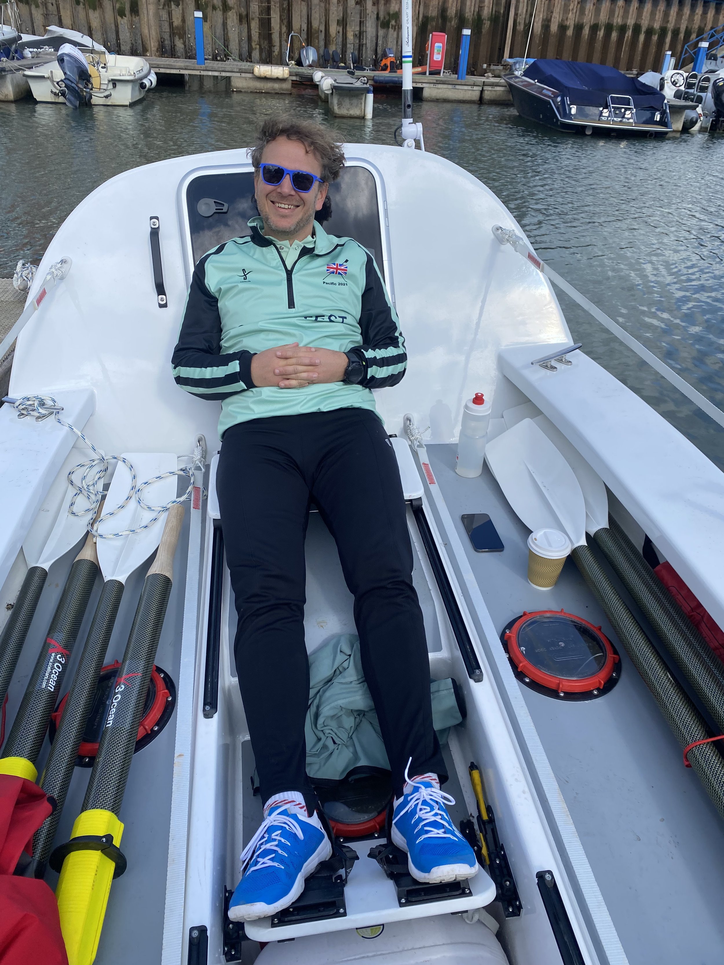 Simon, a member of the Endurance Limits Amazon Row adventure team, relaxing in the rowing boat.