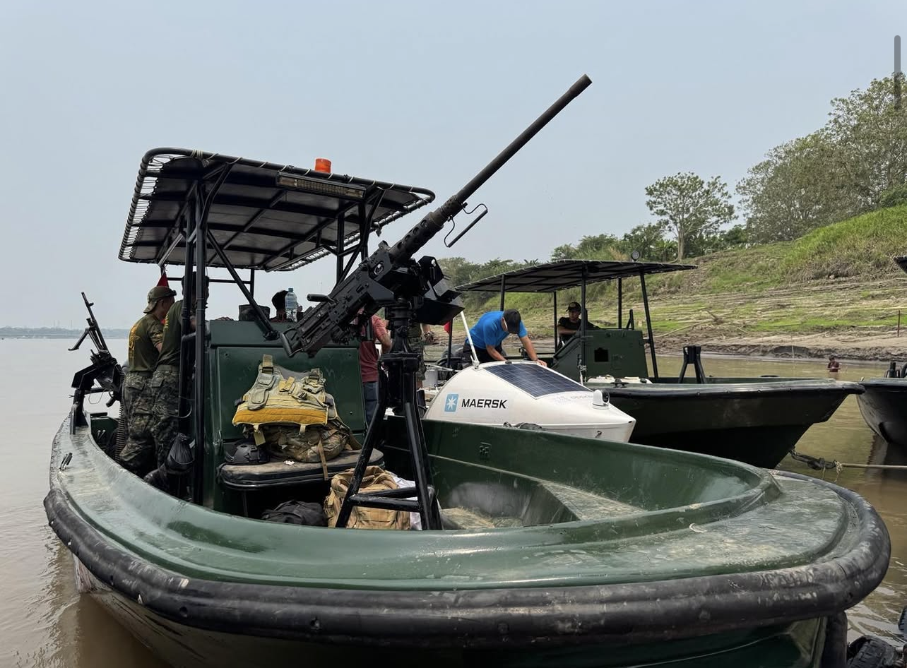 Endurance Limits Amazon Row expedition boat undergoing a legal border check with local authorities on the Amazon River.