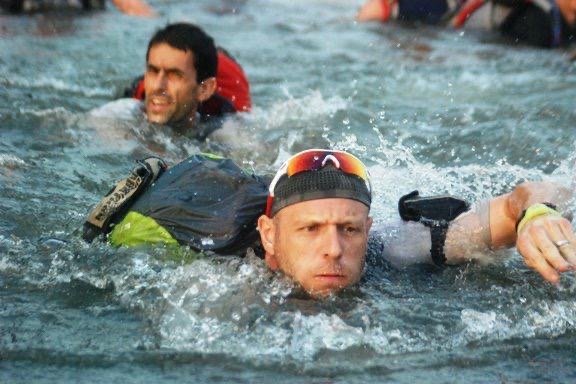 Darren of the Endurance Limits Brazil Jungle Ultra Marathon team swimming through a river during the adventure race.
