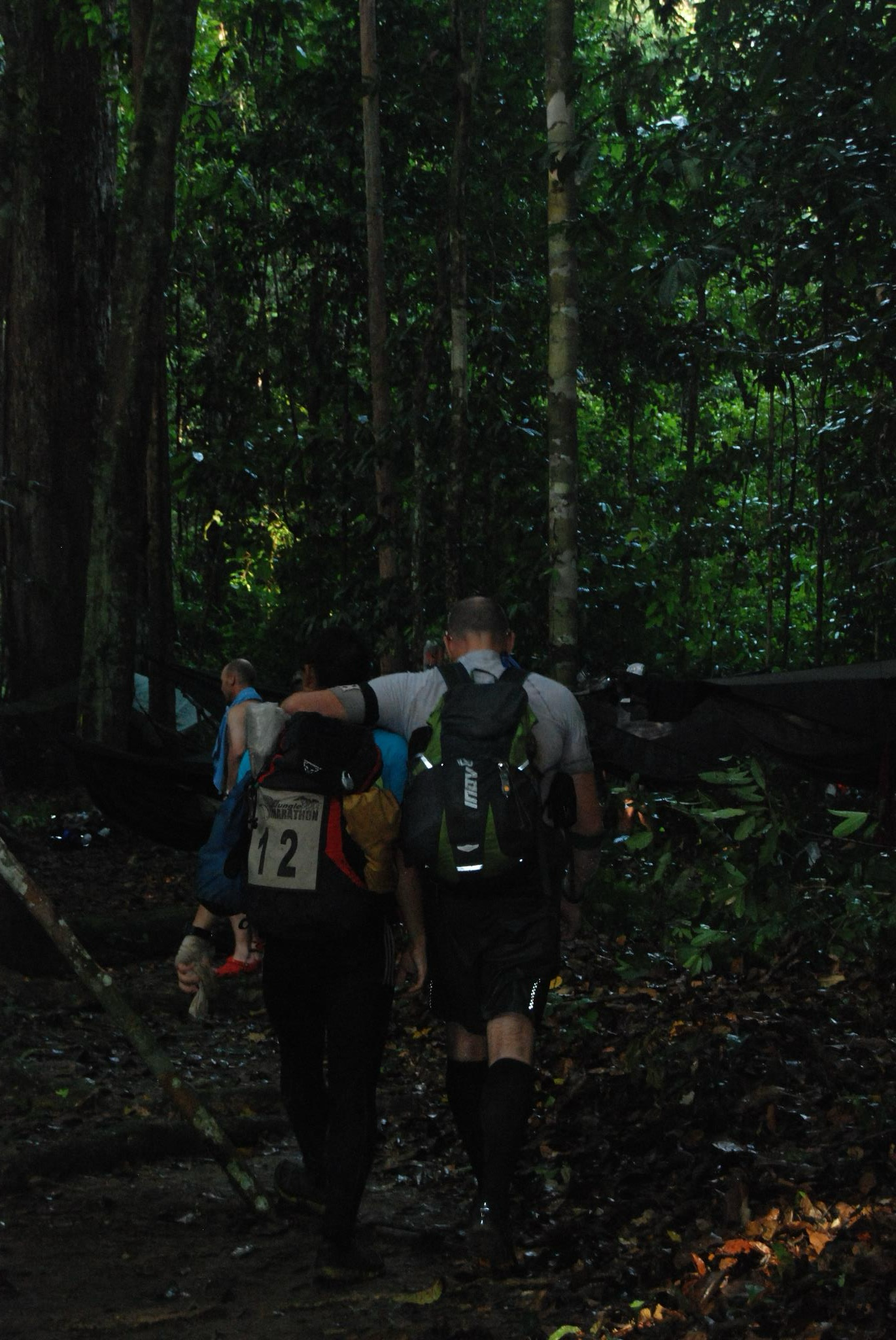 Endurance Limits Brazil Jungle Ultra Marathon team trekking through the jungle at night during the adventure in support of Great Ormond Street Hospital.