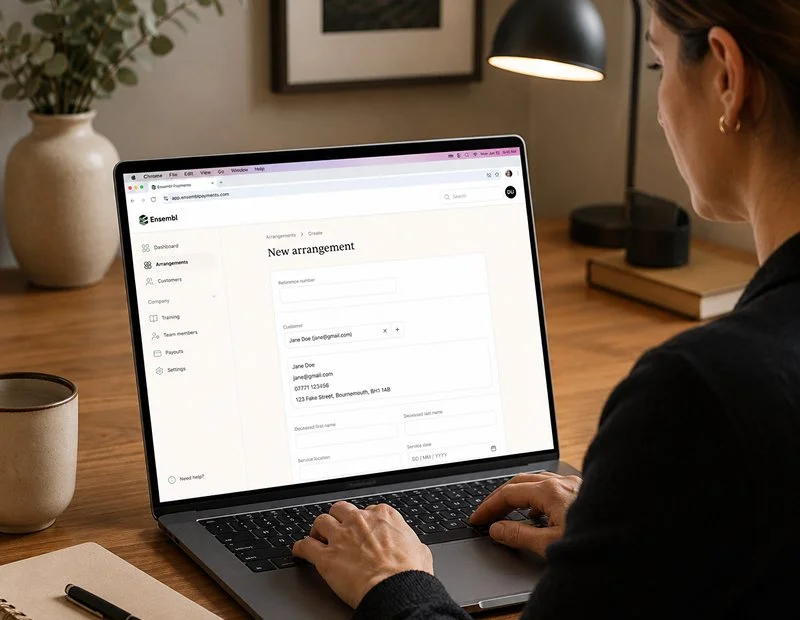 Woman sitting at a desk adding a new arrangement into ensemble payments platform
