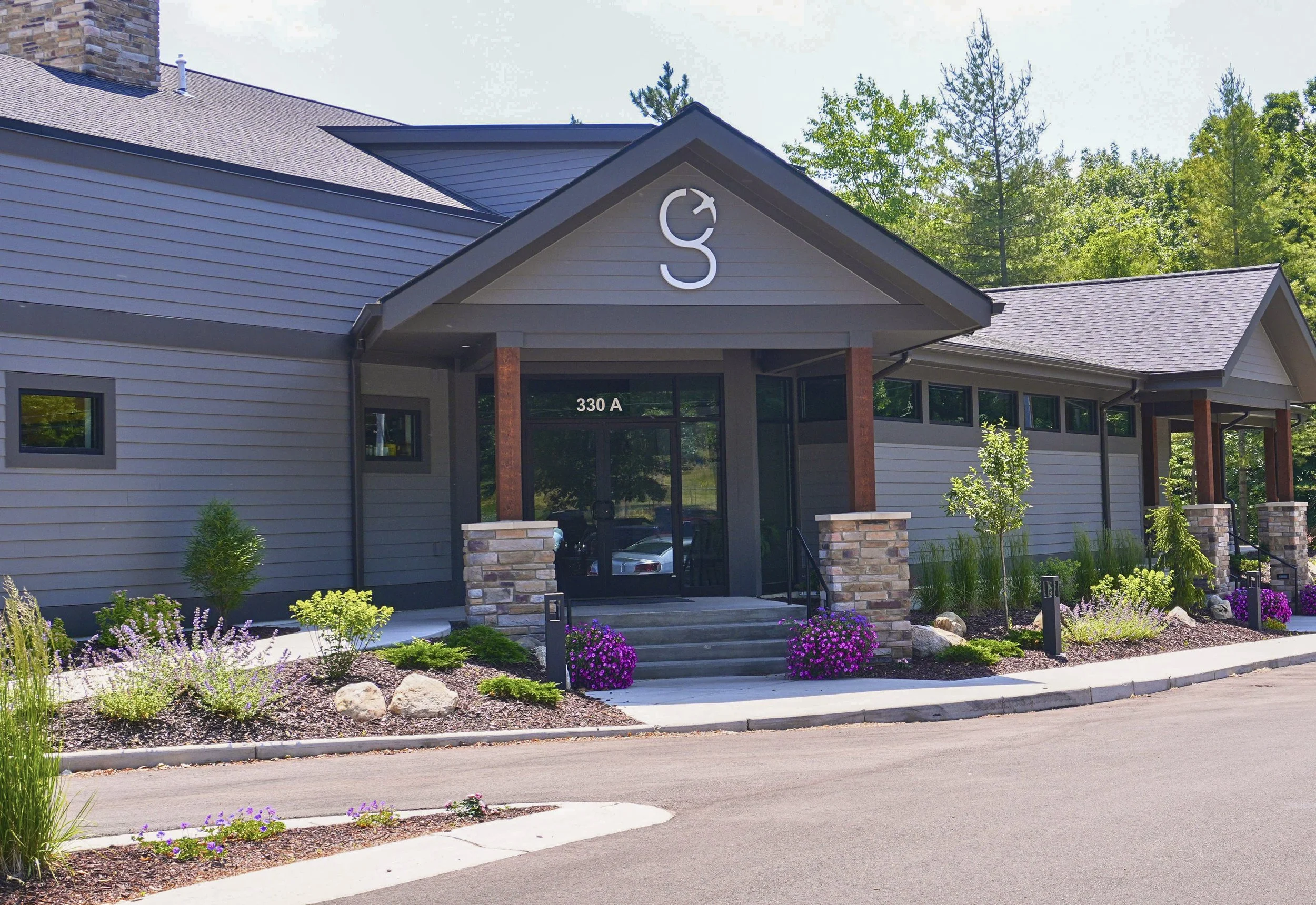 Commercial building resided with custom color James Hardie siding and matching trim