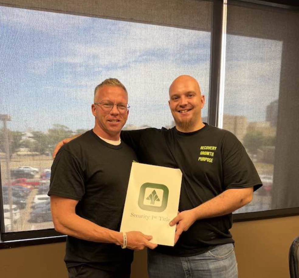 Seek First Capital investor client celebrating a closing at Security 1st Title in Wichita